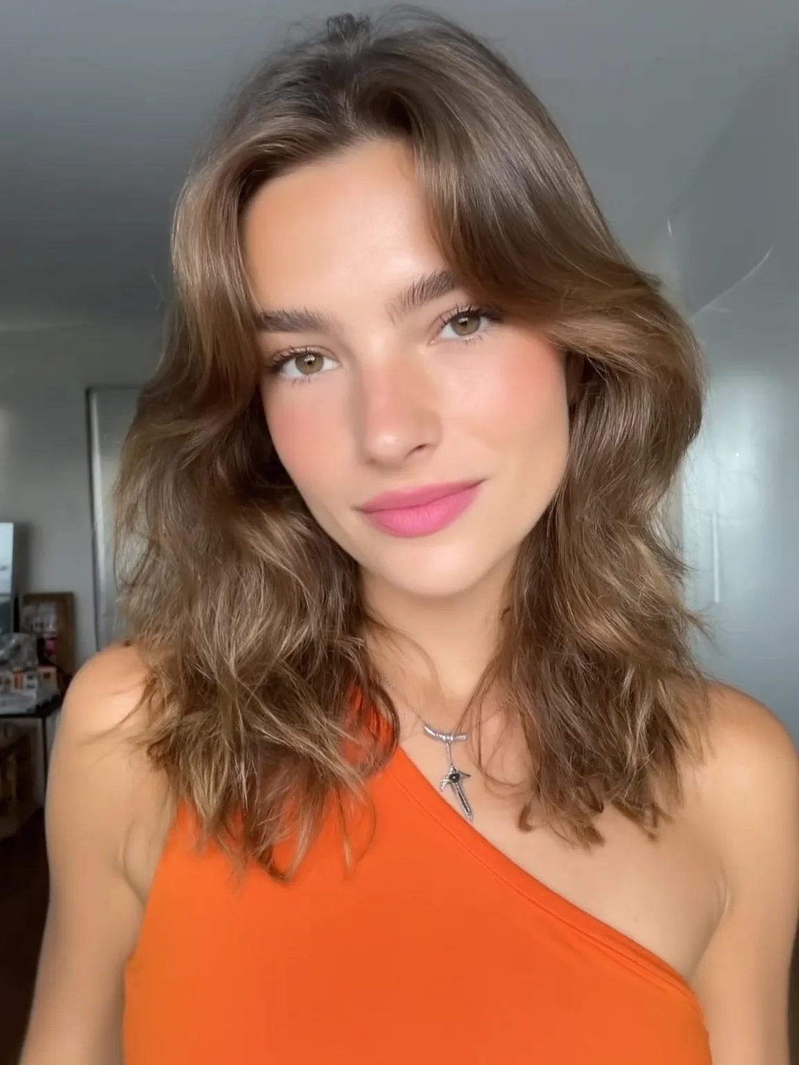 Shoulder-Length Layered Cut with Soft Curtain Bangs